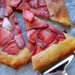 a server picks up a slice of Keto pastry with strawberry filling