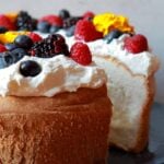 a low carb angel food cake with a piece sliced out