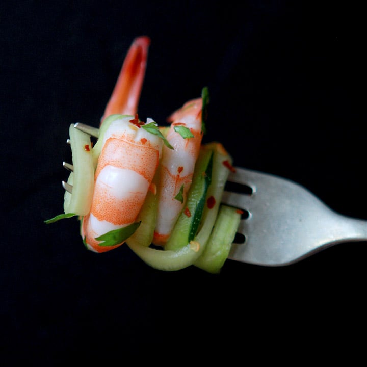 a forkful of shrimps and zoodles