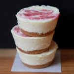 a stack of Keto Mini Cheesecakes against a black background