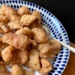 a side view of a bowl of low carb cereal with a spoon in it