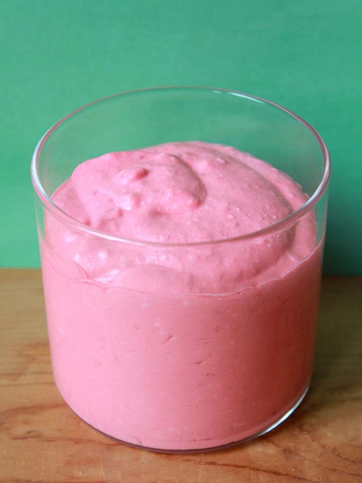 a glass filled with Keto Raspberry Mousse