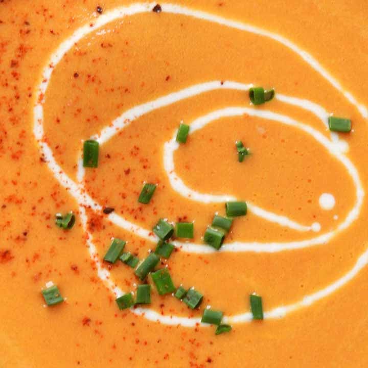a close-up of the surface of a bowl of low carb carrot soup
