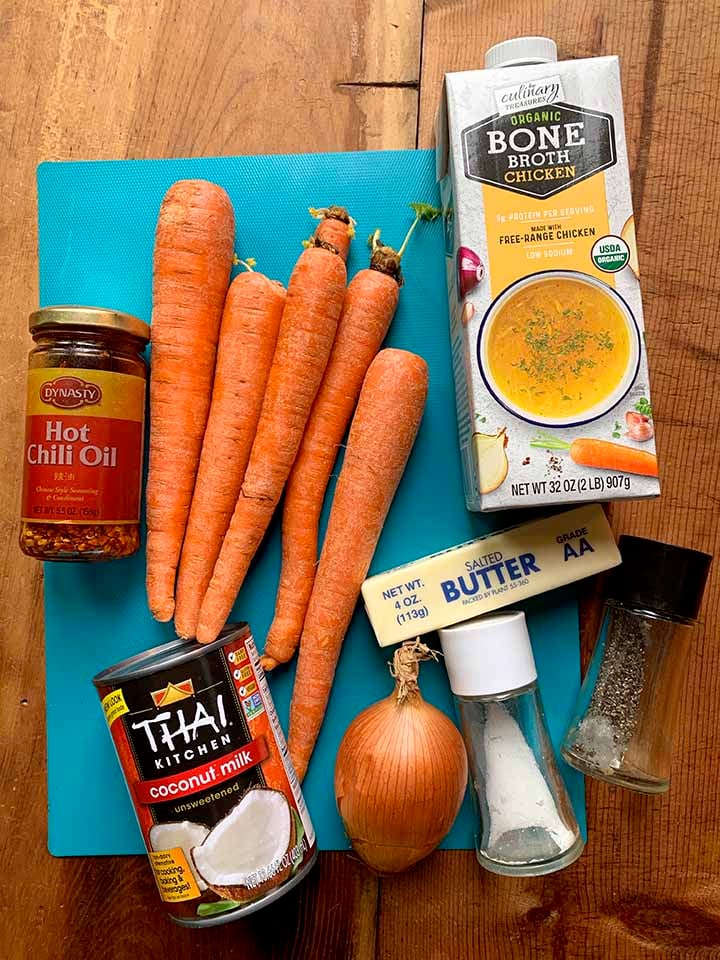 the ingredients for creamy carrot coconut soup