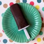 a Keto chocolate pudding pop on an aqua plate