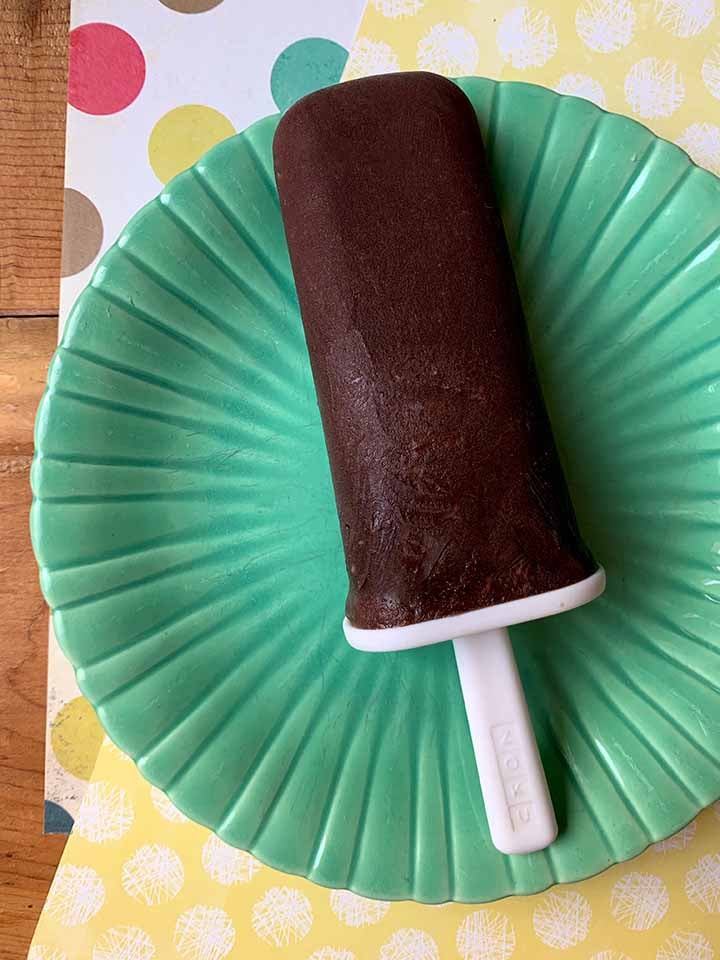 a gluten-free fudgesicle on a green plate