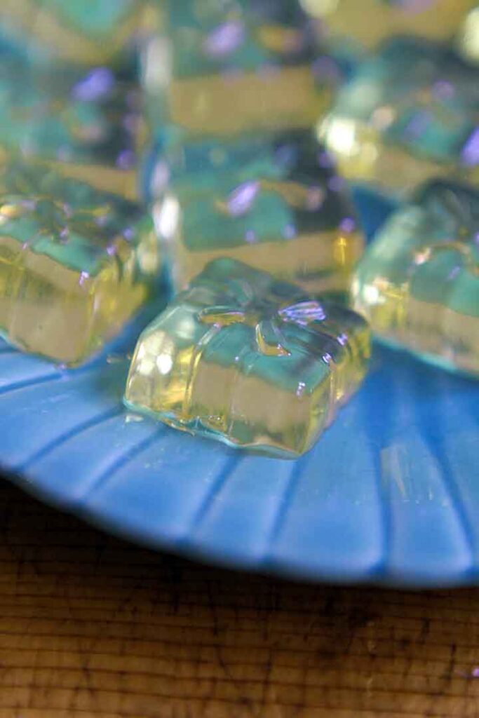 Apple Cider Vinegar Gummy gift shapes on a blue plate