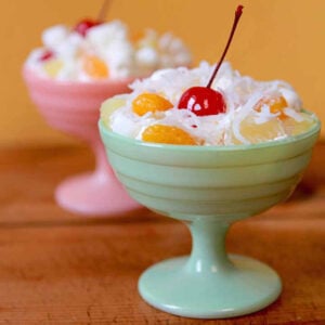 two dishes of Ambrosia Salad with cherries on top