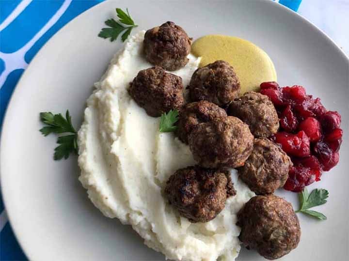 a close up of Swedish Meatballs Keto Mashed Cauliflower, Cream Sauce and Cranberry Jam