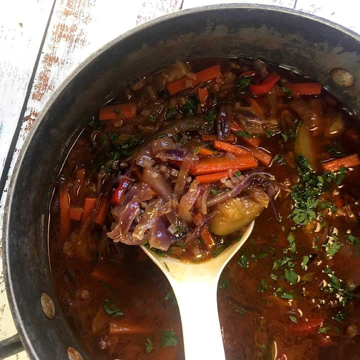 a ladle ladles up some low carb beef and vegetable soup