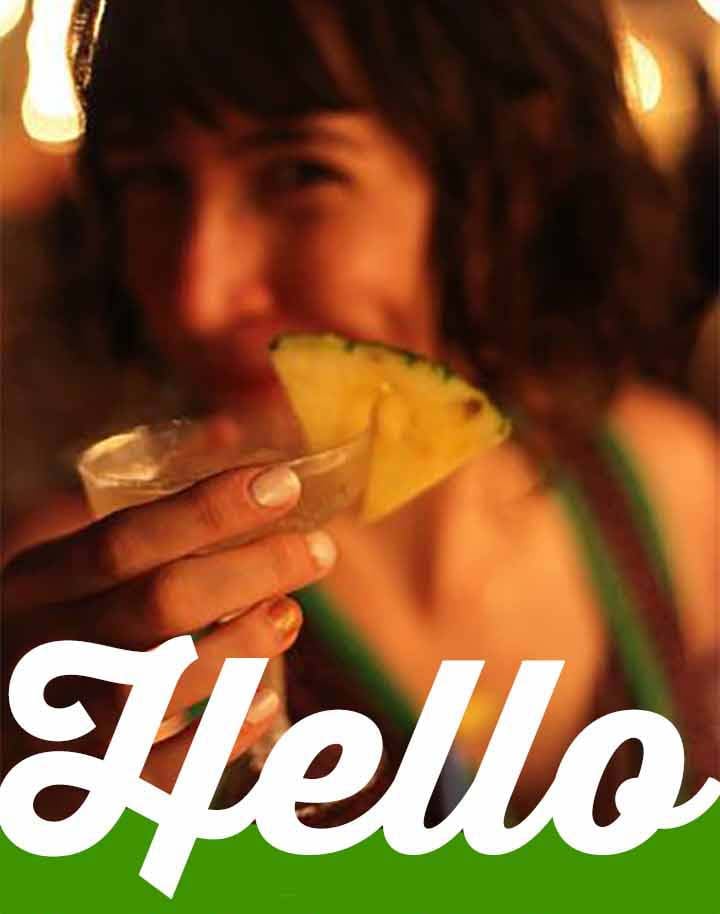 a photo of Emily with a cocktail with text that says Hello
