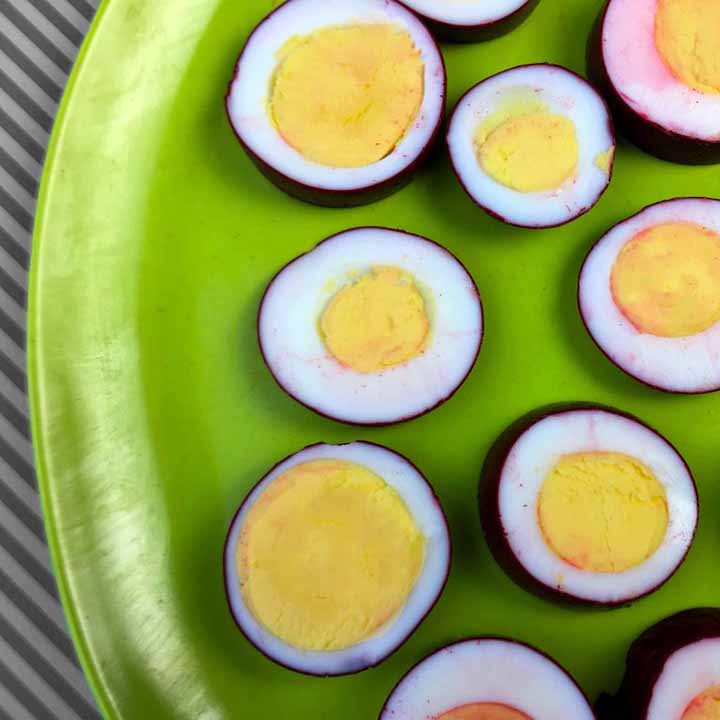 a green plate with sugar-free pickled eggs