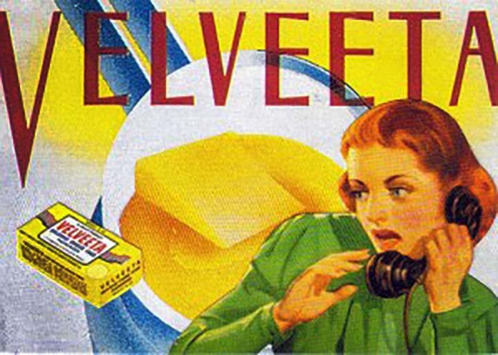 a vintage ad of a woman shocked by Velveeta Cheese Food
