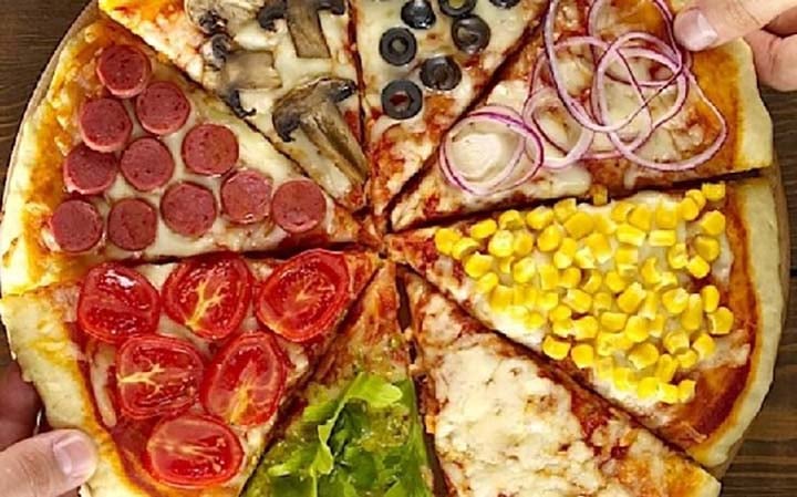 a pizza pie with different toppings