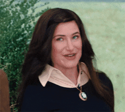 a gif of a woman winking