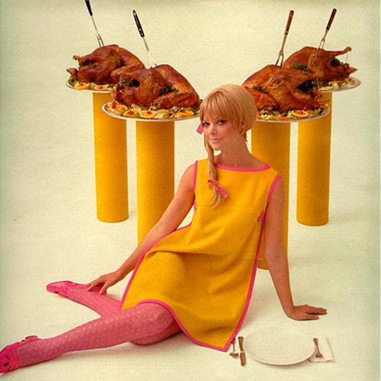 a 70's ad of a woman surrounded by roasted turkeys