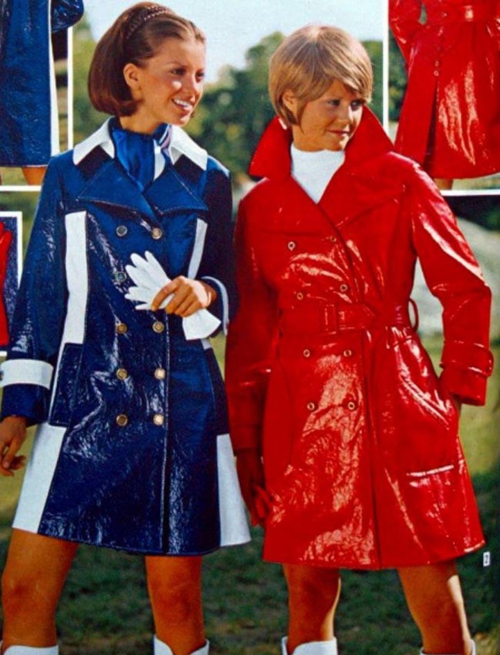 two 1970s women wearing raincoats