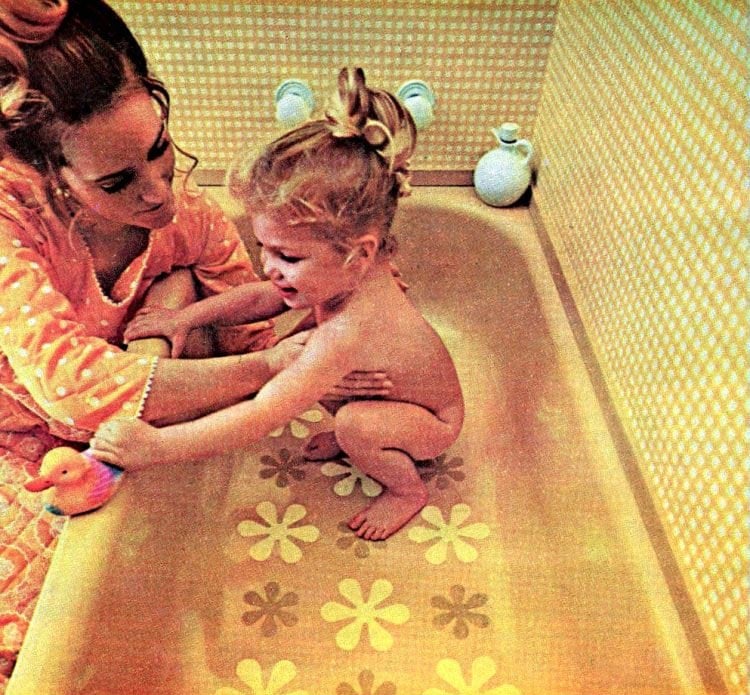 1970's woman and baby in tub