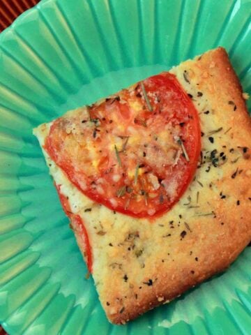 a green plate with a Focaccia Carbquik Recipe