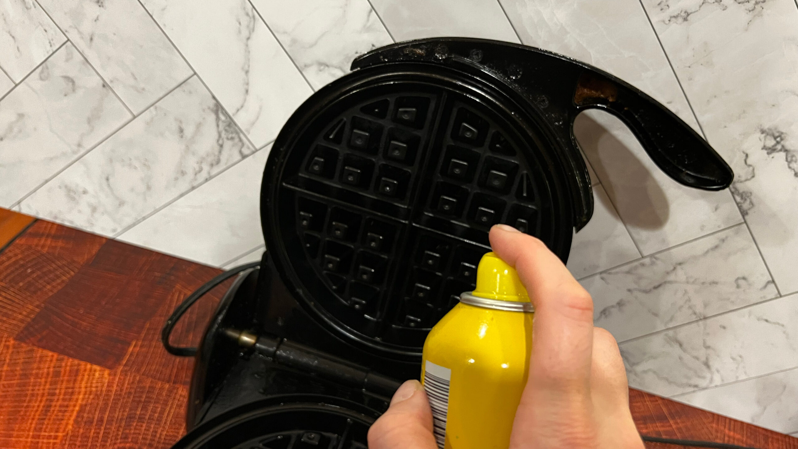 Spray the waffle iron.