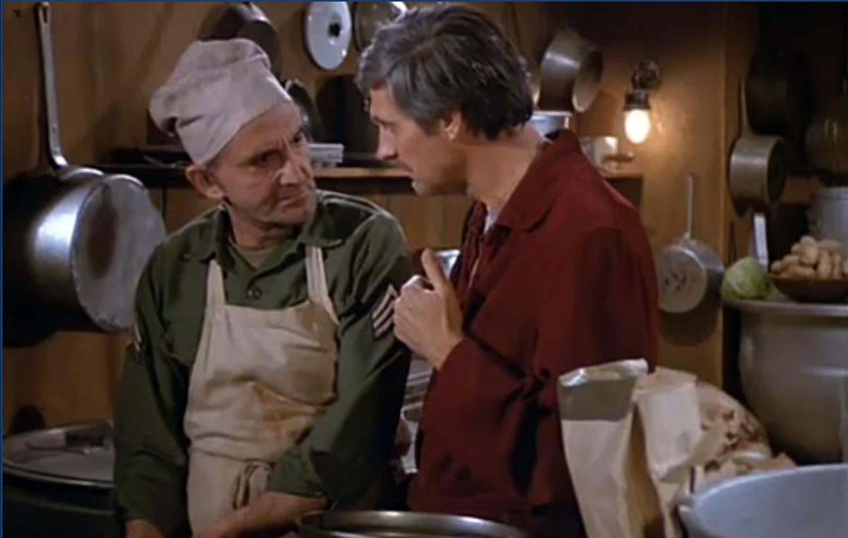a scene from MASH where Hawkeye teaches the cook how to make French toast