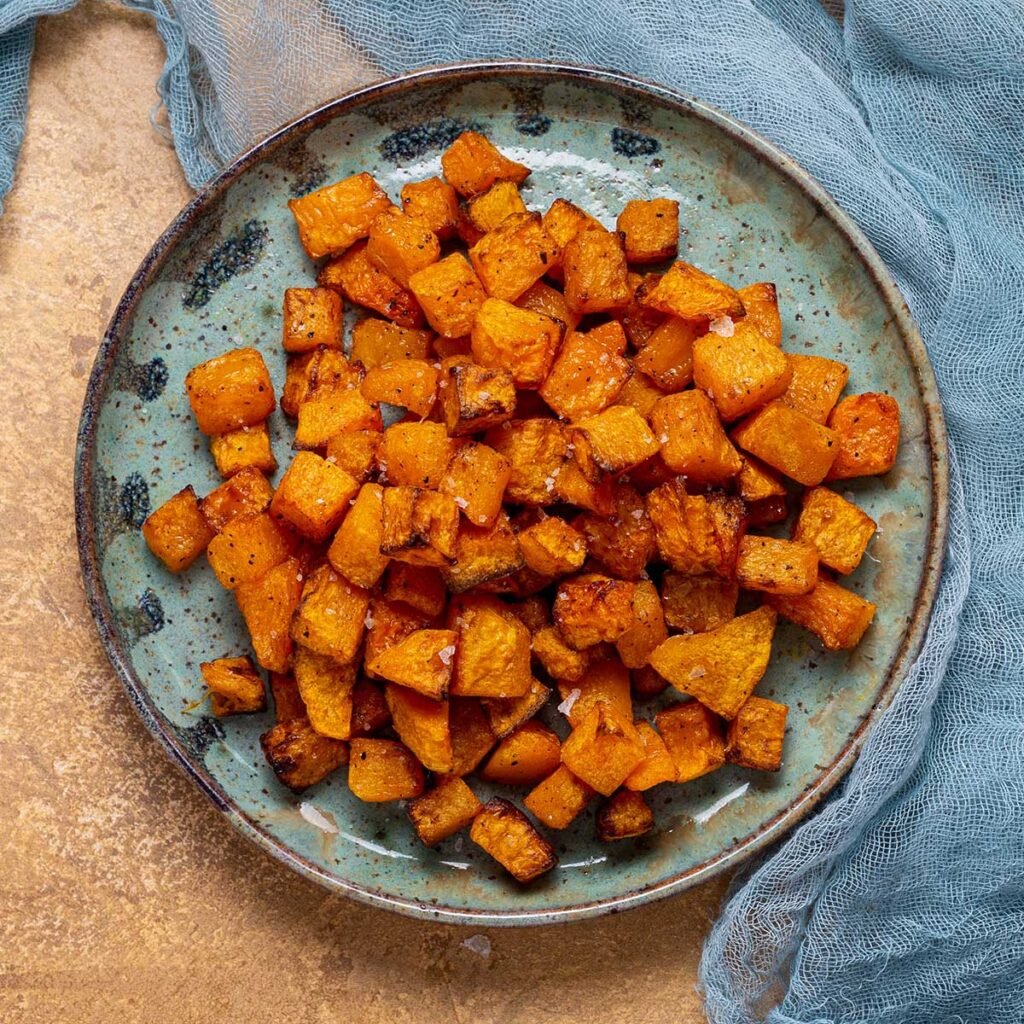 a top down view of a plate of cubed and air fried squash