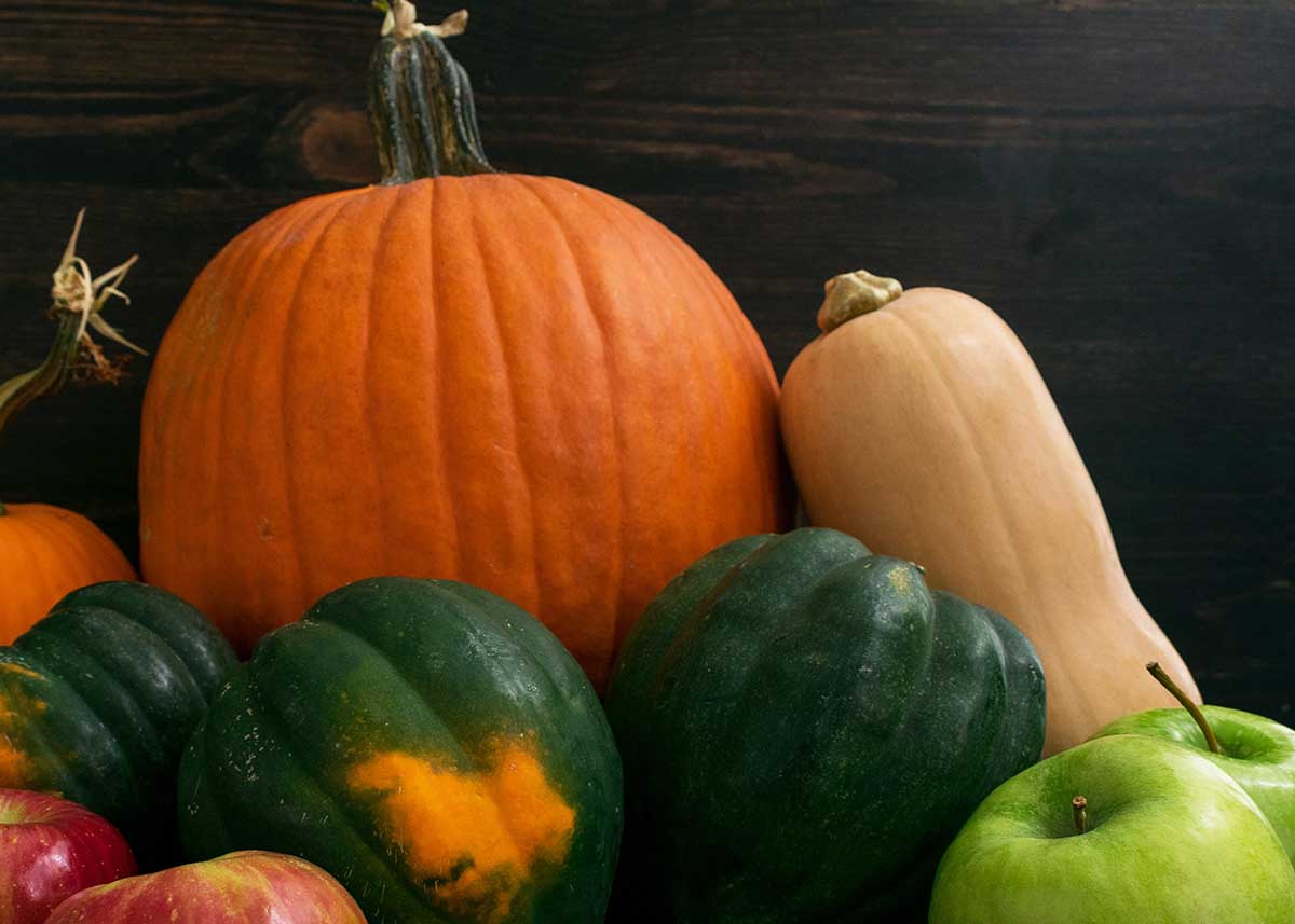 a pile of different types of squash.