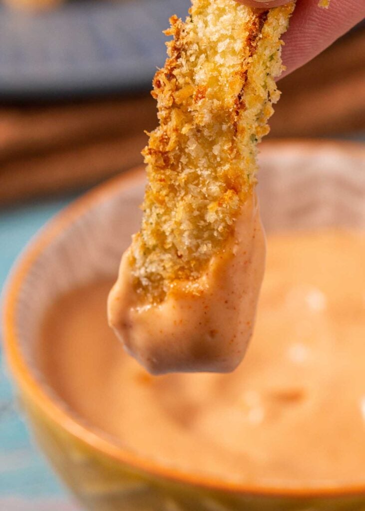 a zucchini fry dipped in yum yum sauce.