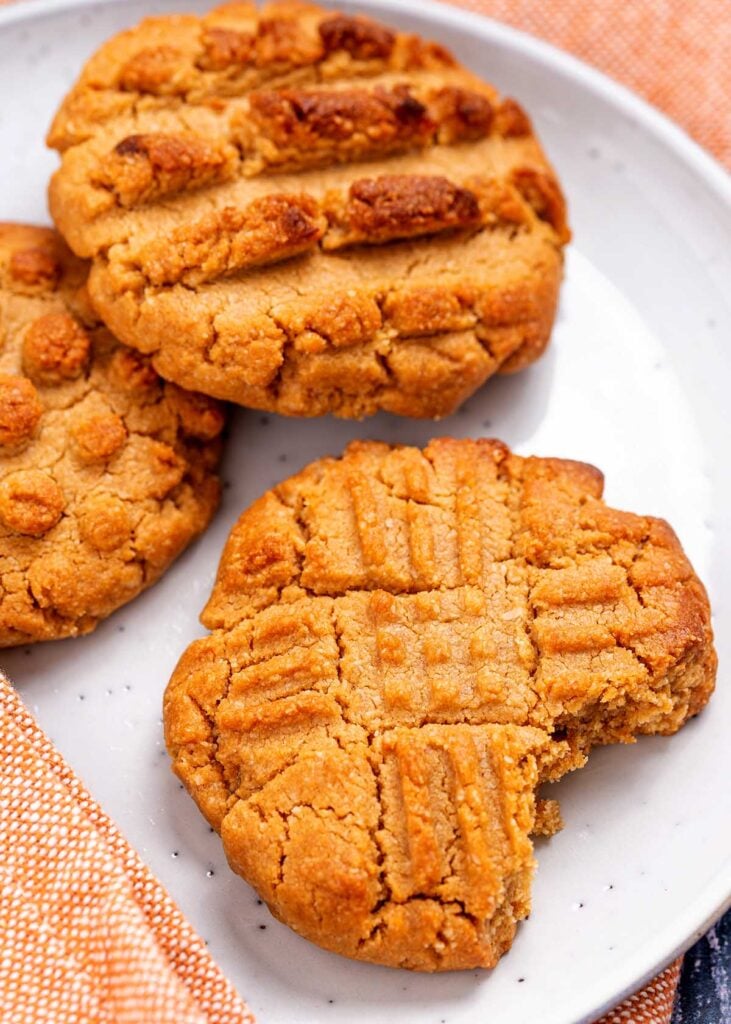 a peanut butter cookie with a bite taken out of it.