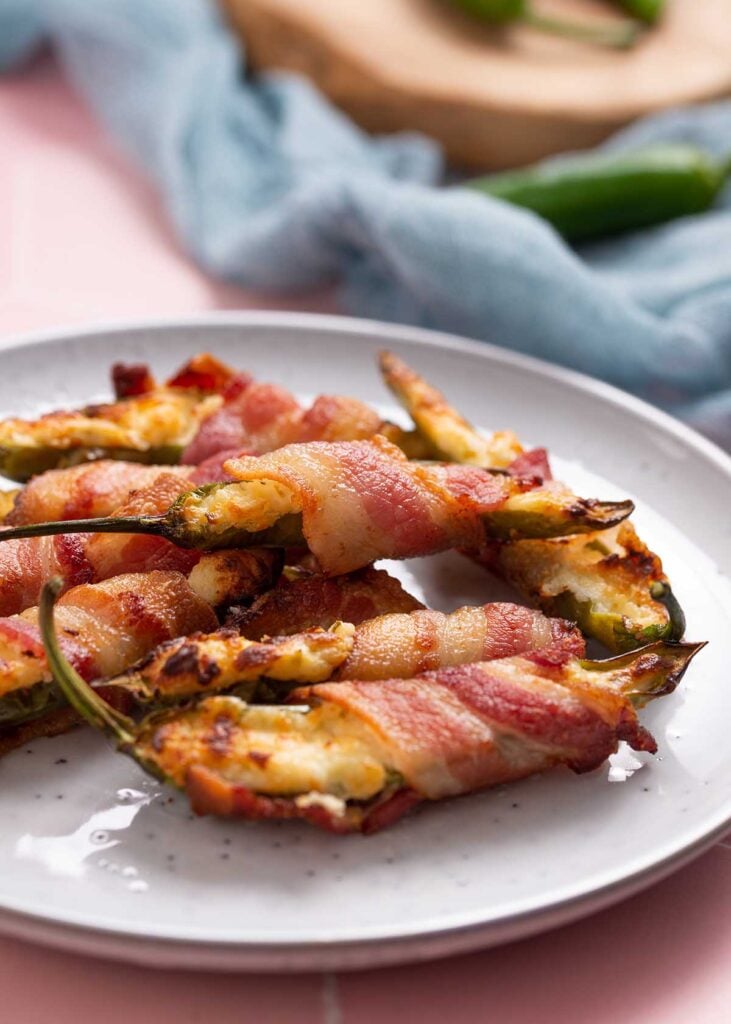 a plate of 8 bacon-wrapped air fried poppers.